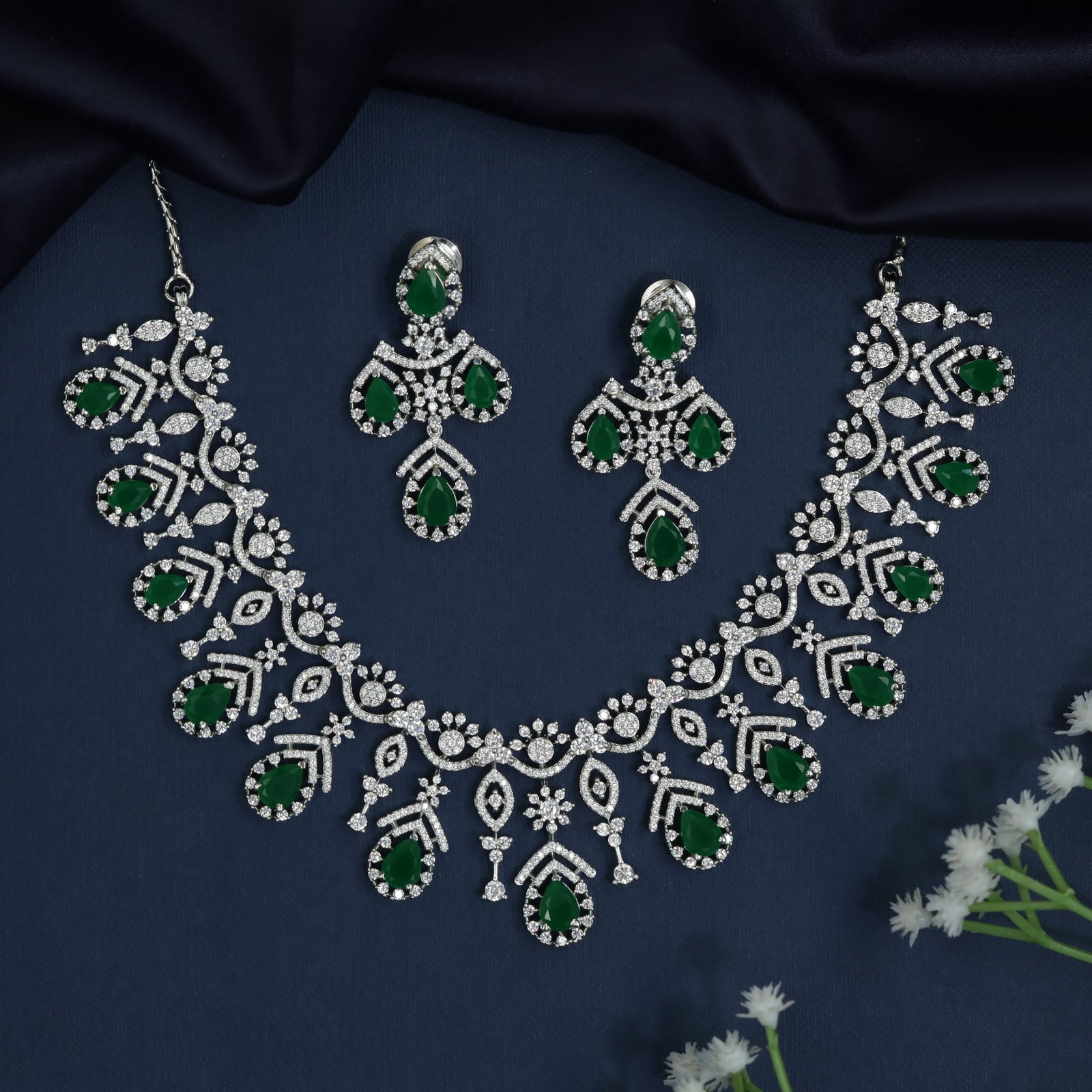 Rosette frame necklace with articulated fringe detailing
