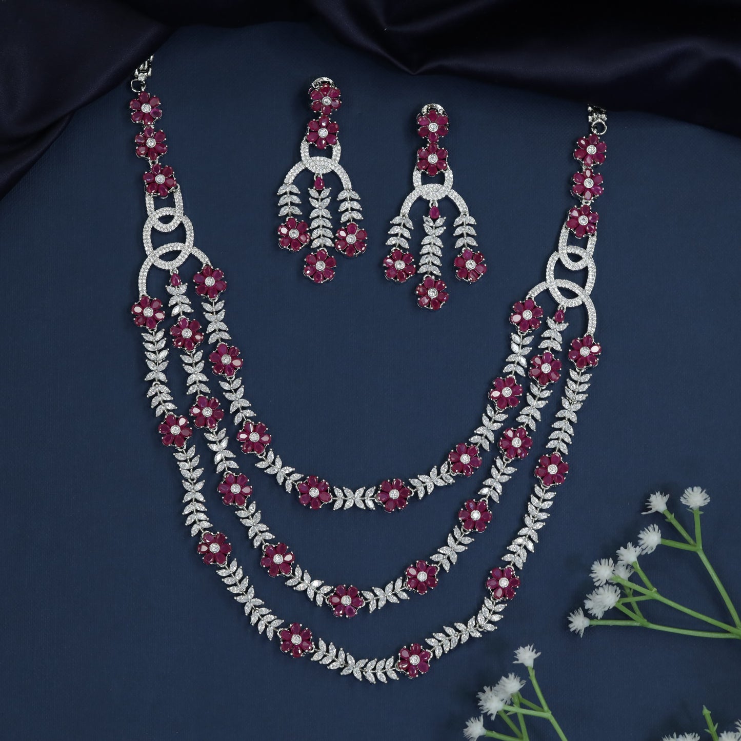 Triple Strand Rhodium Necklace with Floral Spacer Detailing