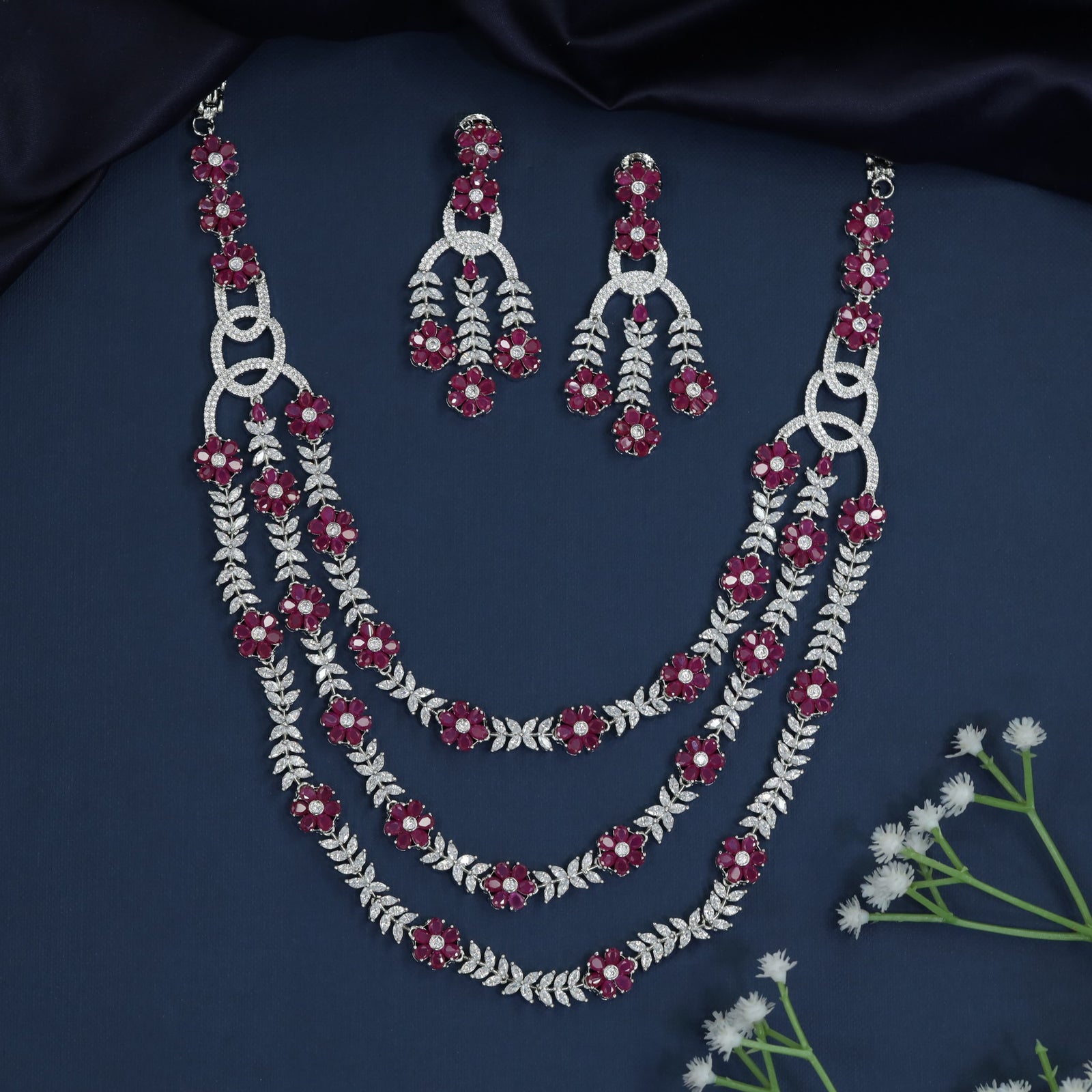 Triple Strand Rhodium Necklace with Floral Spacer Detailing