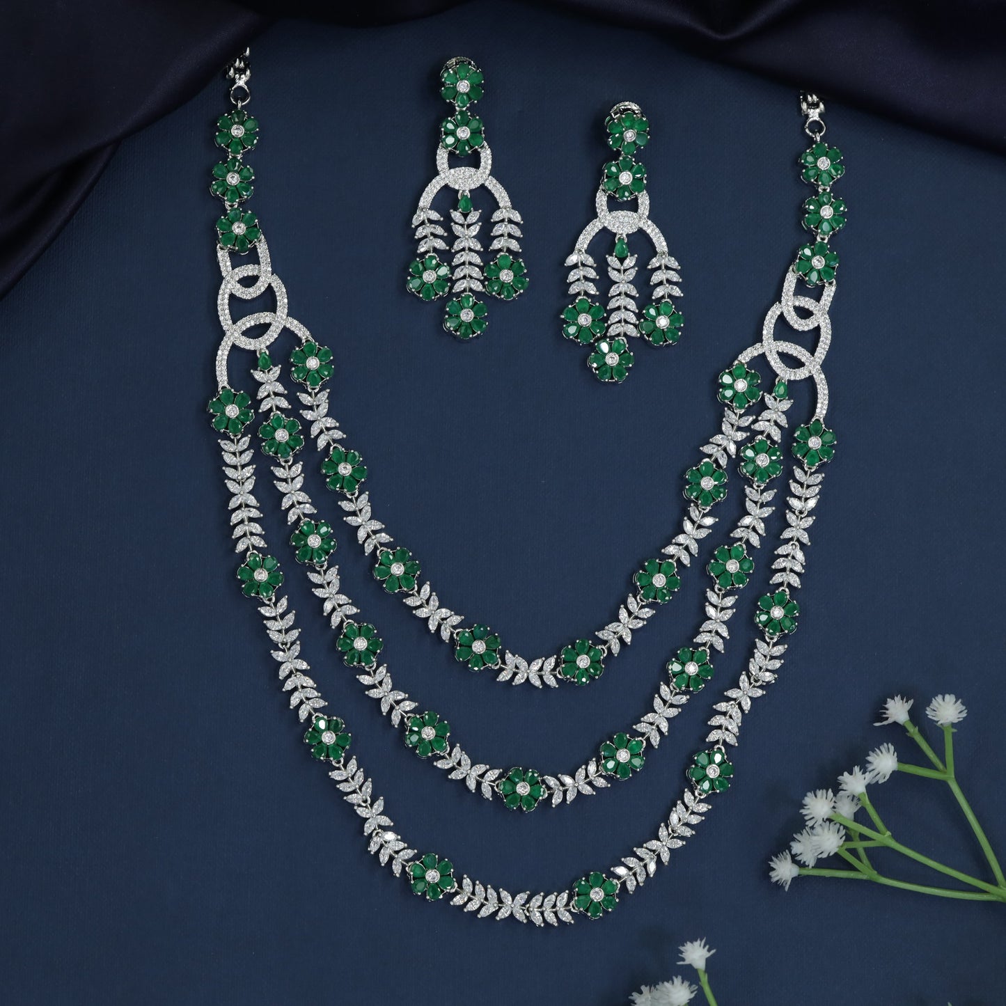 Triple Strand Rhodium Necklace with Floral Spacer Detailing
