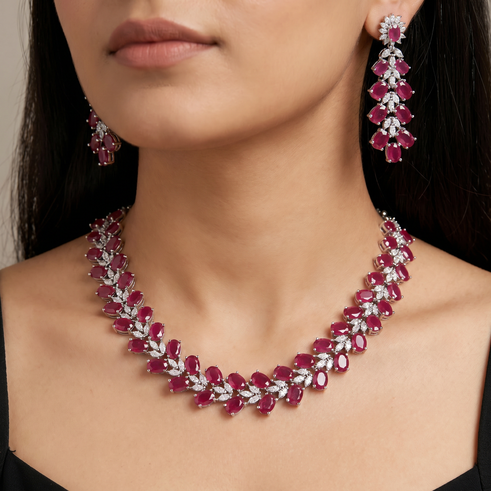 Designer necklace with sculpted gemstone arrangement