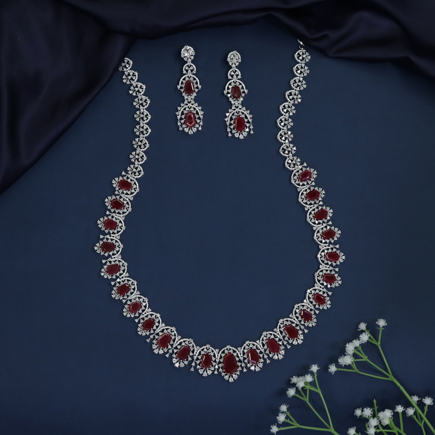 Floral link long haara with graduated oval arrangement