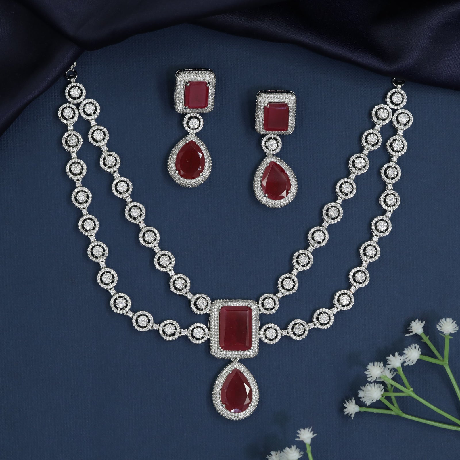 Circular frame necklace with pendant drop centerpiece