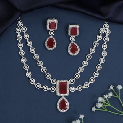 Circular frame necklace with pendant drop centerpiece