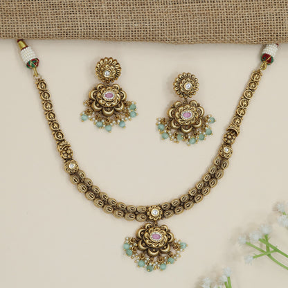 Traditional flower pendant necklace with ornate border detailing
