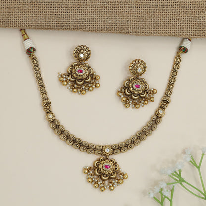 Traditional flower pendant necklace with ornate border detailing