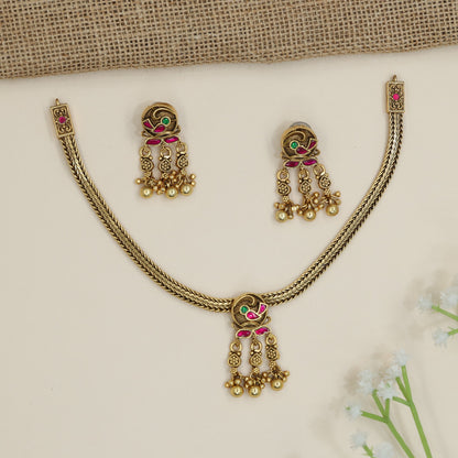 Parrot motif necklace with braided chain silhouette and dangling accents
