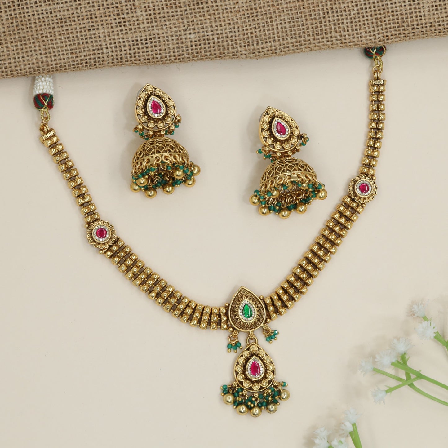 Architectural necklace with layered link construction and pendant drop