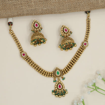 Architectural necklace with layered link construction and pendant drop