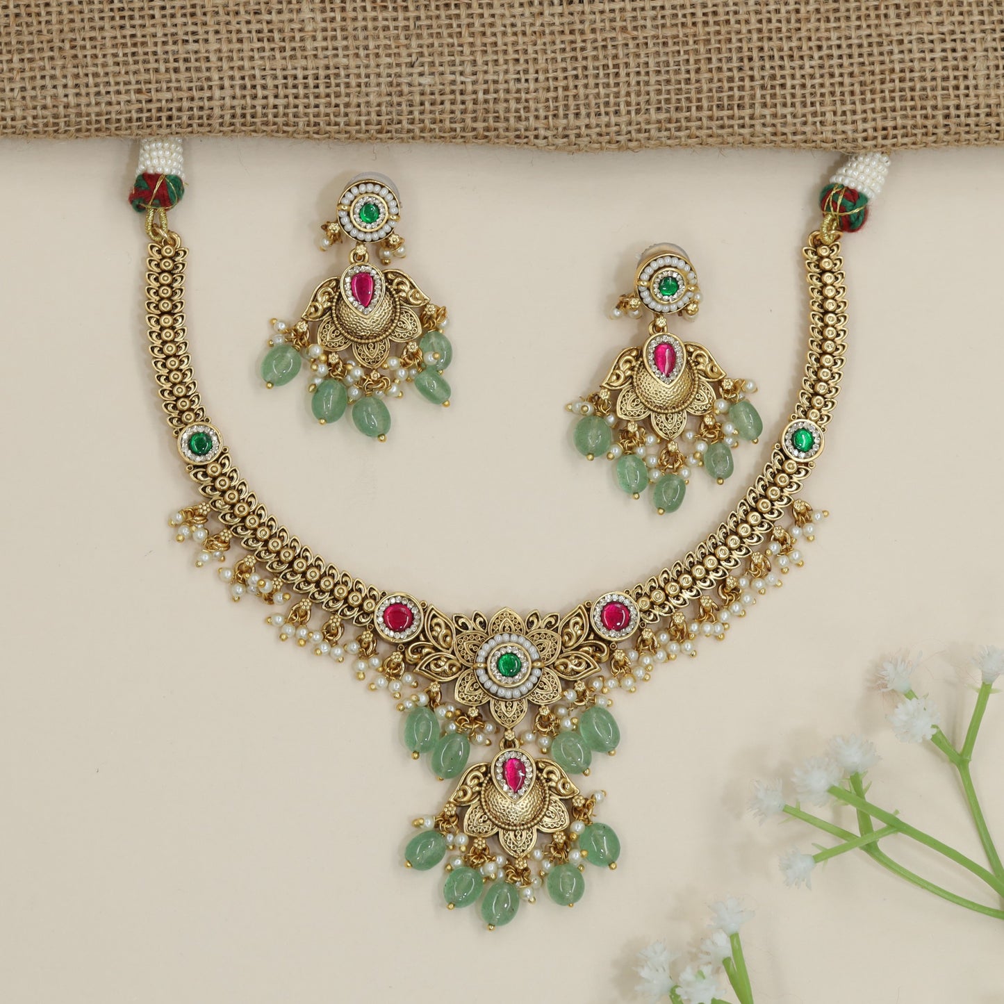 Scrollwork pendant necklace with decorative drop border detailing