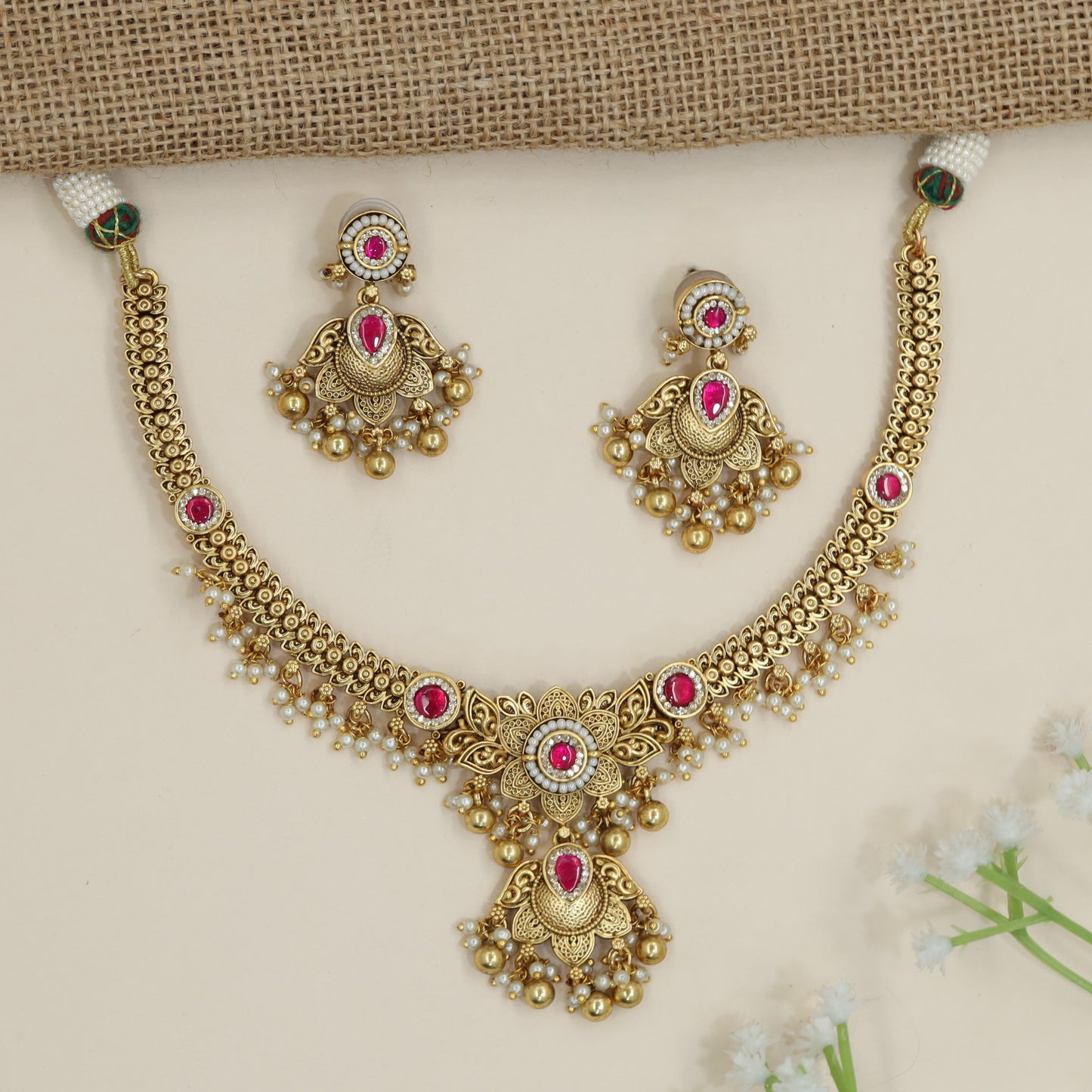 Scrollwork pendant necklace with decorative drop border detailing