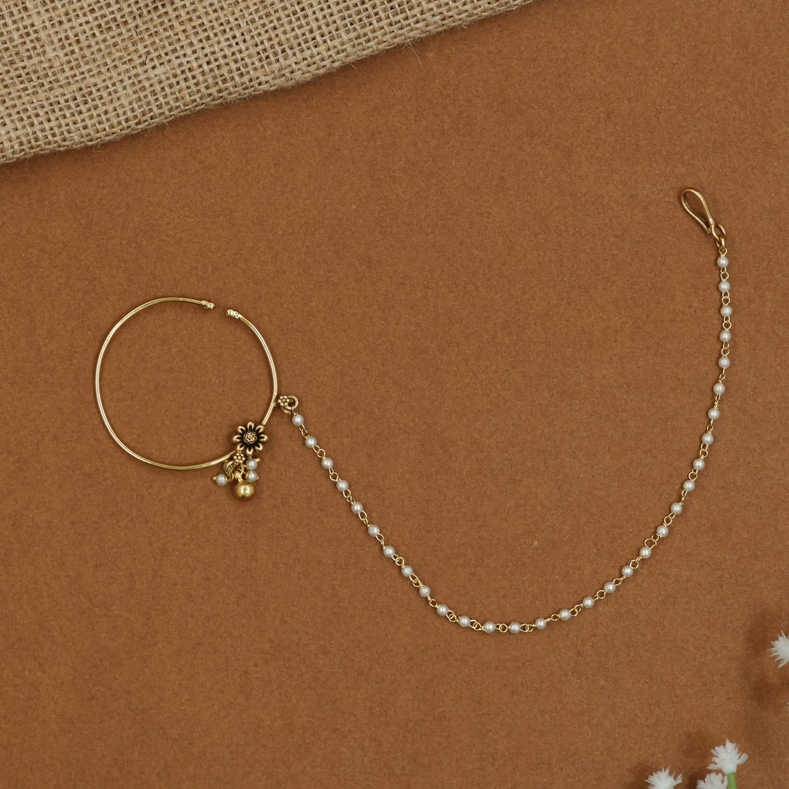 Minimalist Antique Nath with decorative floral centrepiece