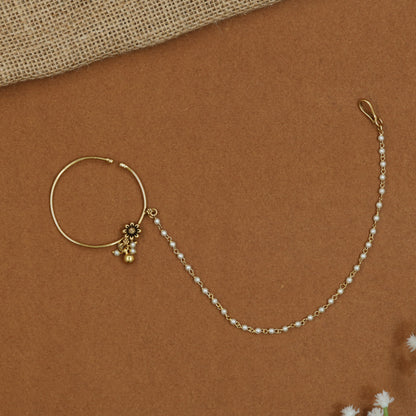 Minimalist Antique Nath with decorative floral centrepiece