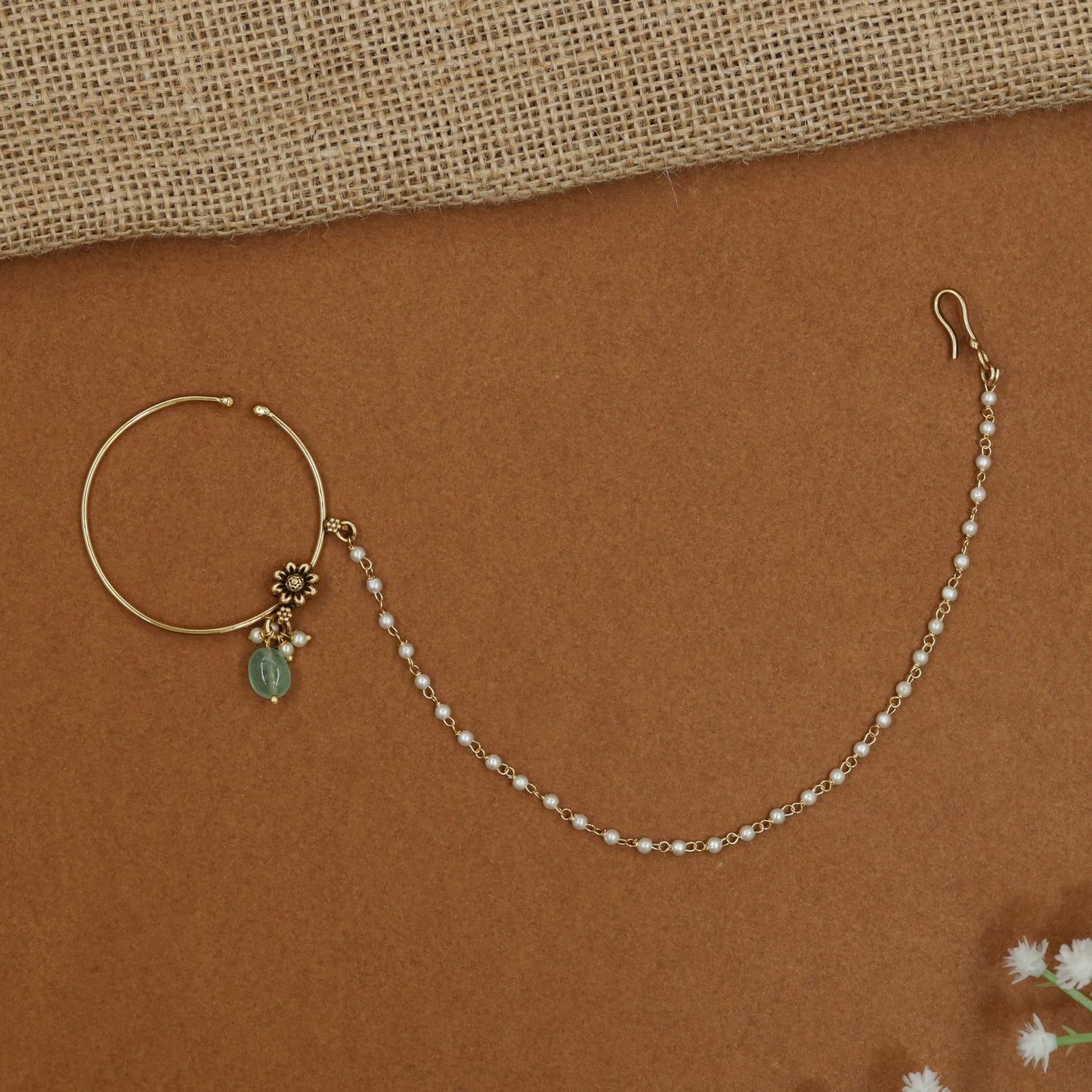 Minimalist Antique Nath with decorative floral centrepiece