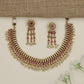 Artisan teardrop necklace with richly textured ornamental design