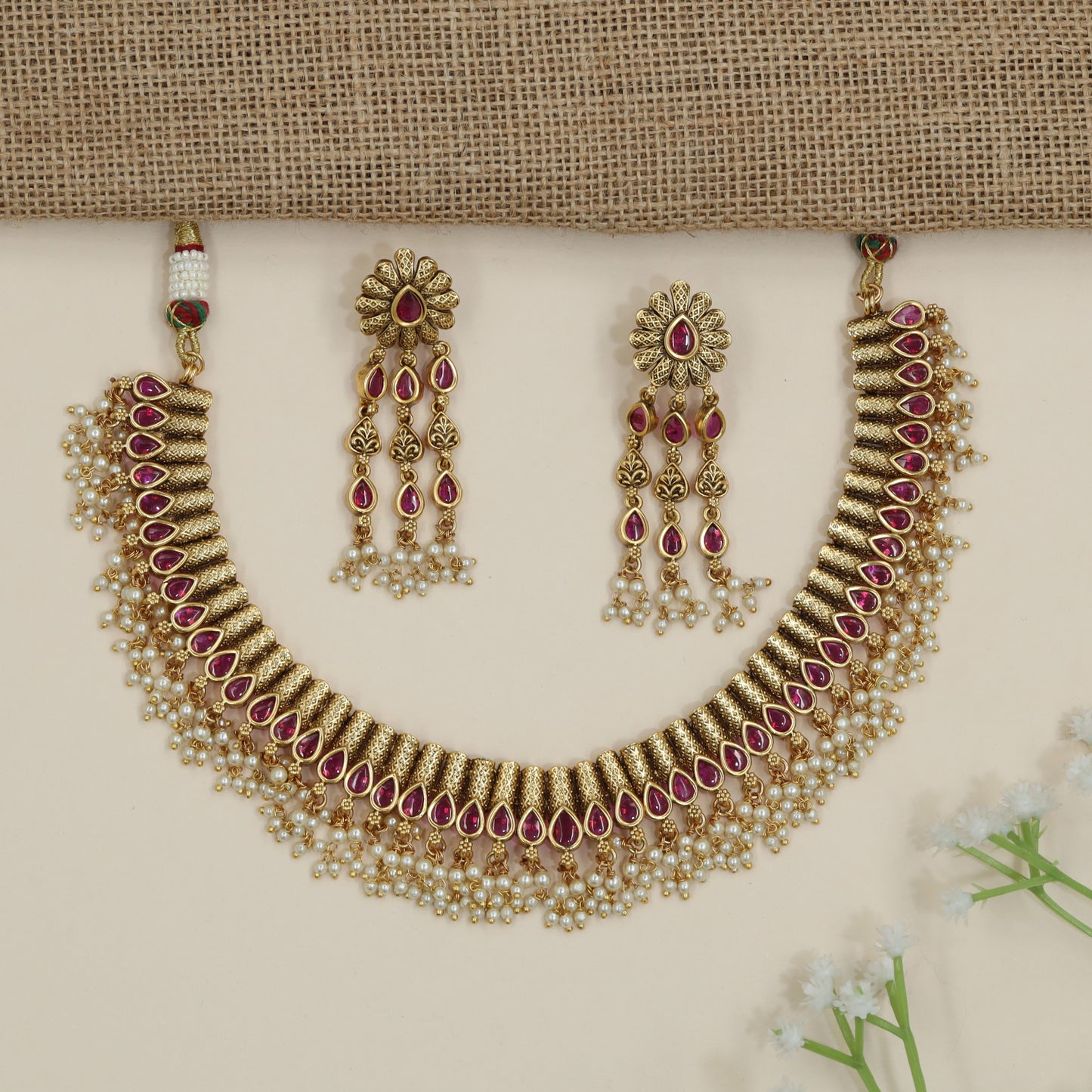 Artisan teardrop necklace with richly textured ornamental design