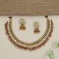 Artisan teardrop necklace with richly textured ornamental design