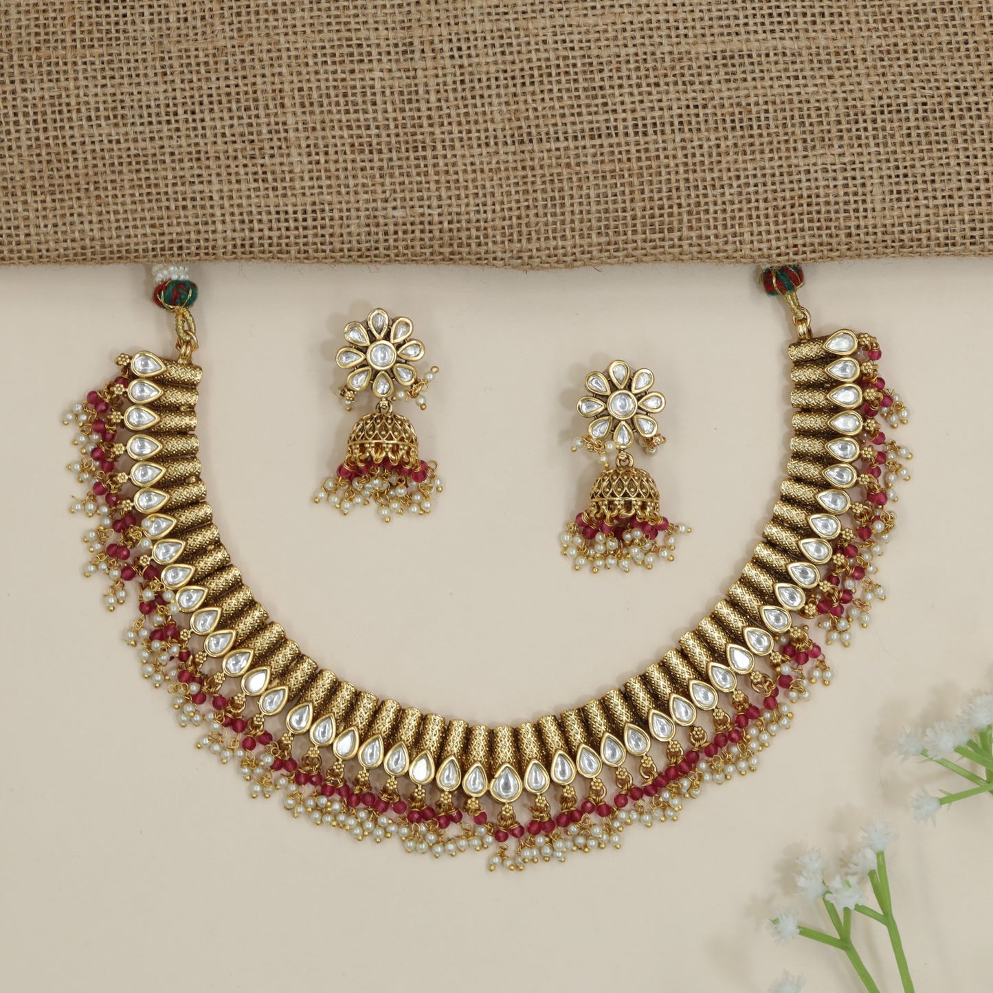 Artisan teardrop necklace with richly textured ornamental design