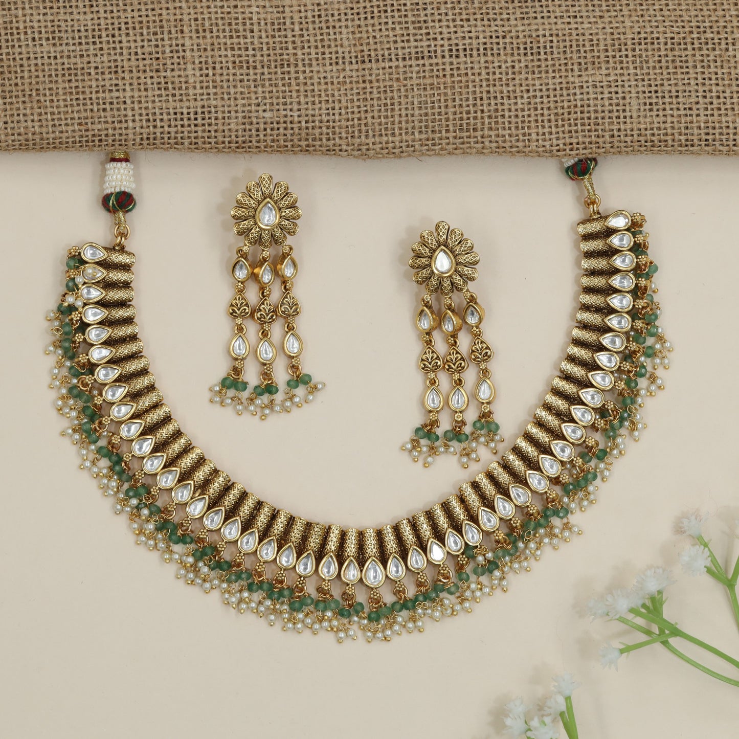 Artisan teardrop necklace with richly textured ornamental design