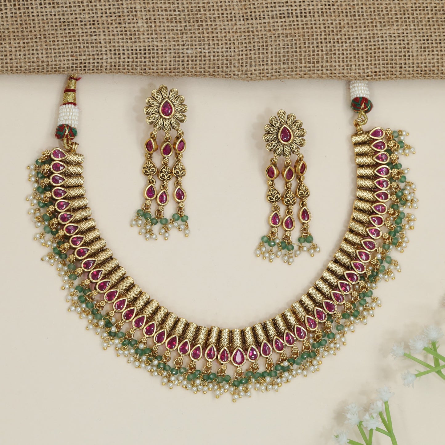 Artisan teardrop necklace with richly textured ornamental design