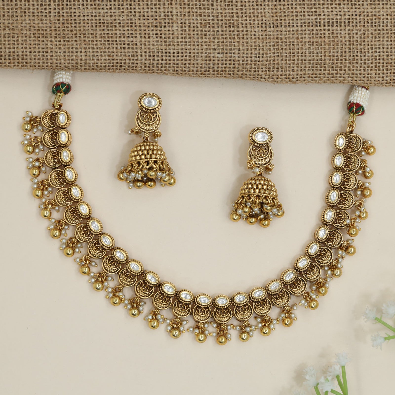 Heirloom crescent pattern necklace with cascading decorative drops