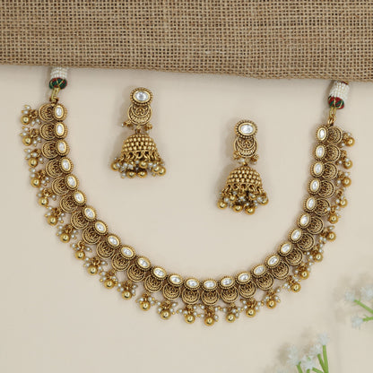 Heirloom crescent pattern necklace with cascading decorative drops