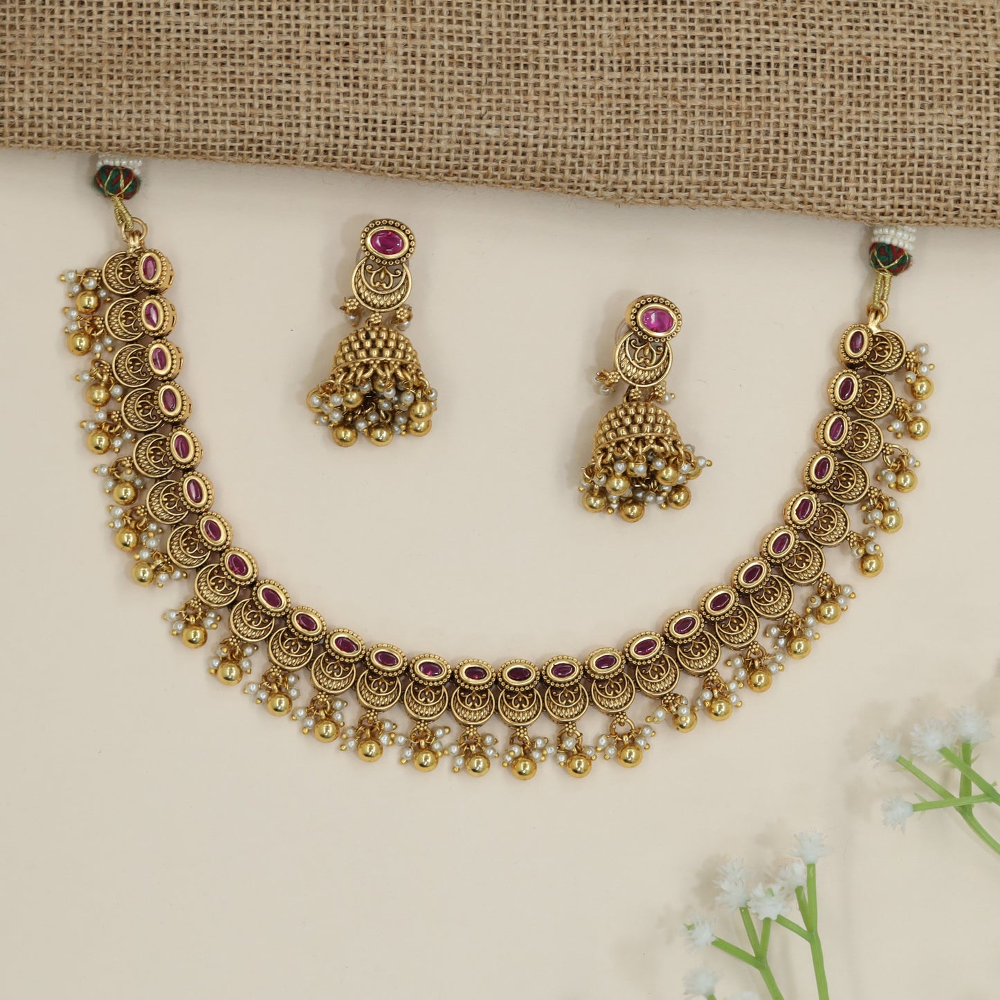 Heirloom crescent pattern necklace with cascading decorative drops