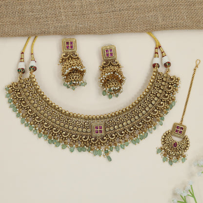 Grand heritage collar necklace with repeating floral coin motifs