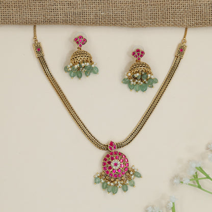 Regal braided chain necklace with floral medallion pendant
