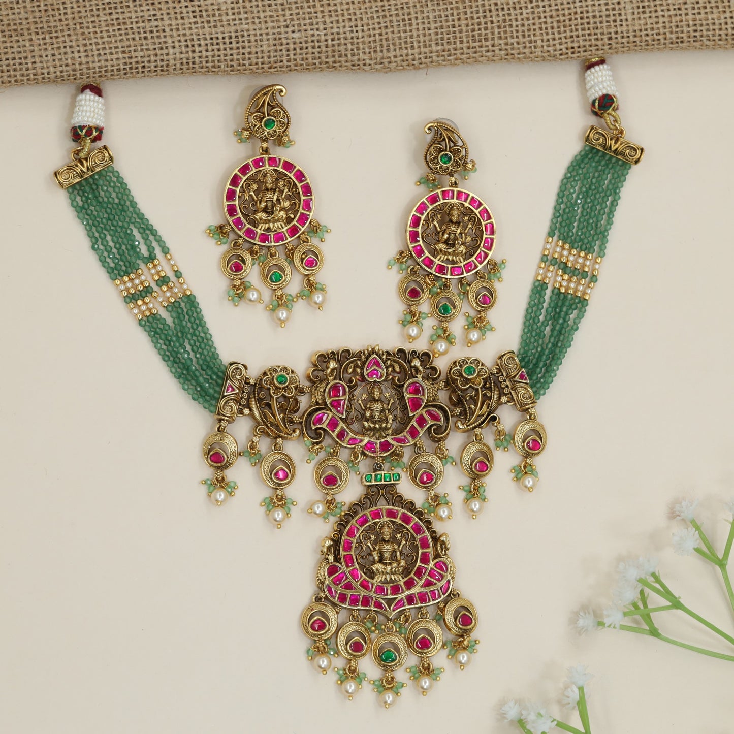 Artisan Lakshmi motif beads necklace with decorative scrollwork accents