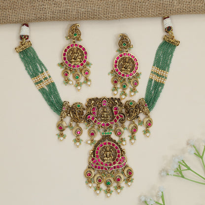 Artisan Lakshmi motif beads necklace with decorative scrollwork accents