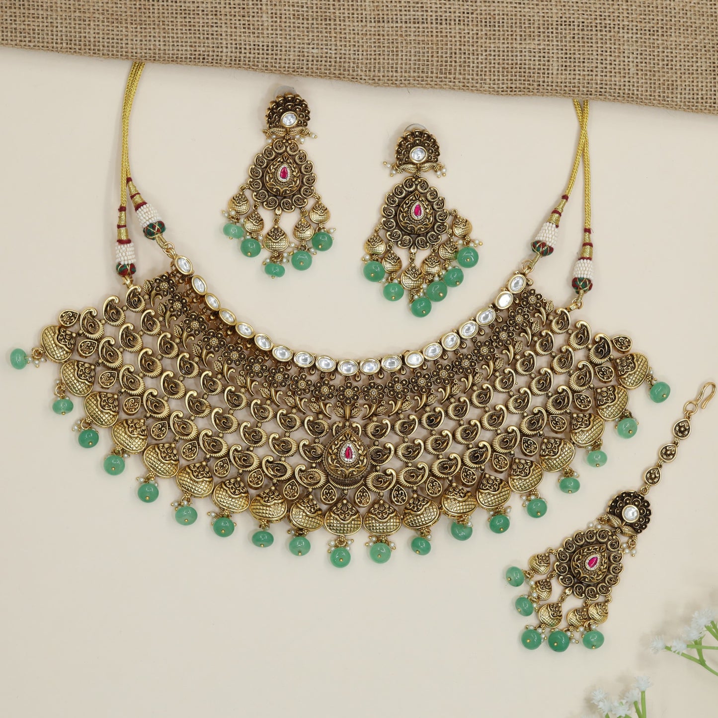 Festive paisley collar choker with ornate medallion detailing