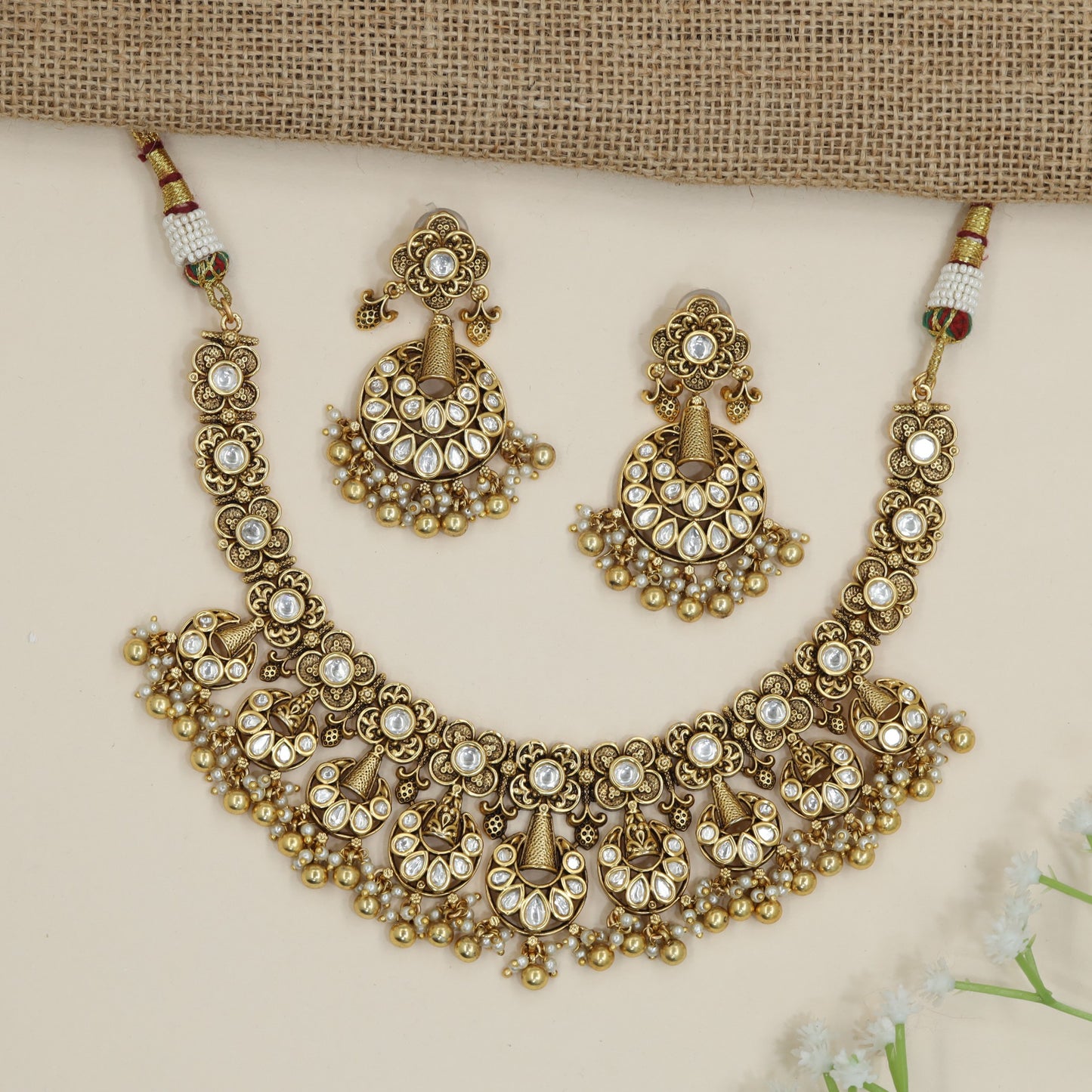 Temple-inspired floral necklace with cascading chandbali accents