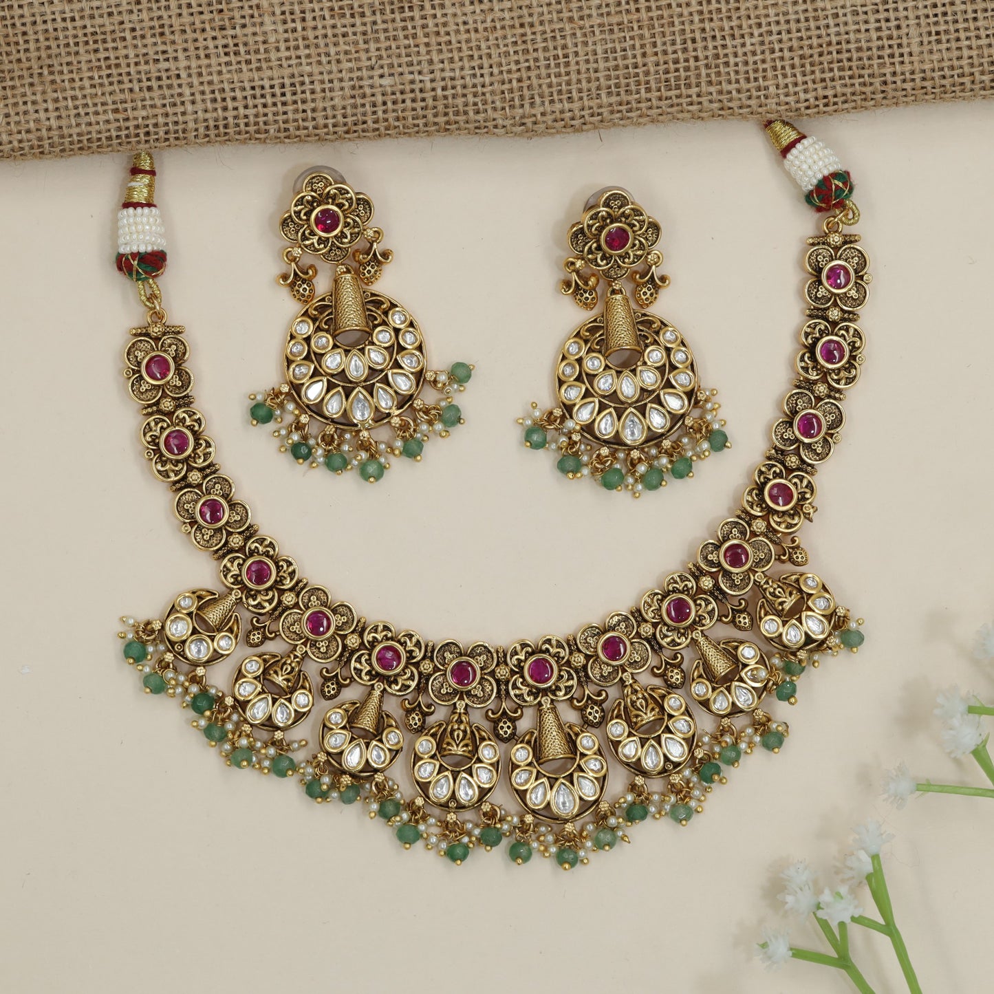 Temple-inspired floral necklace with cascading chandbali accents