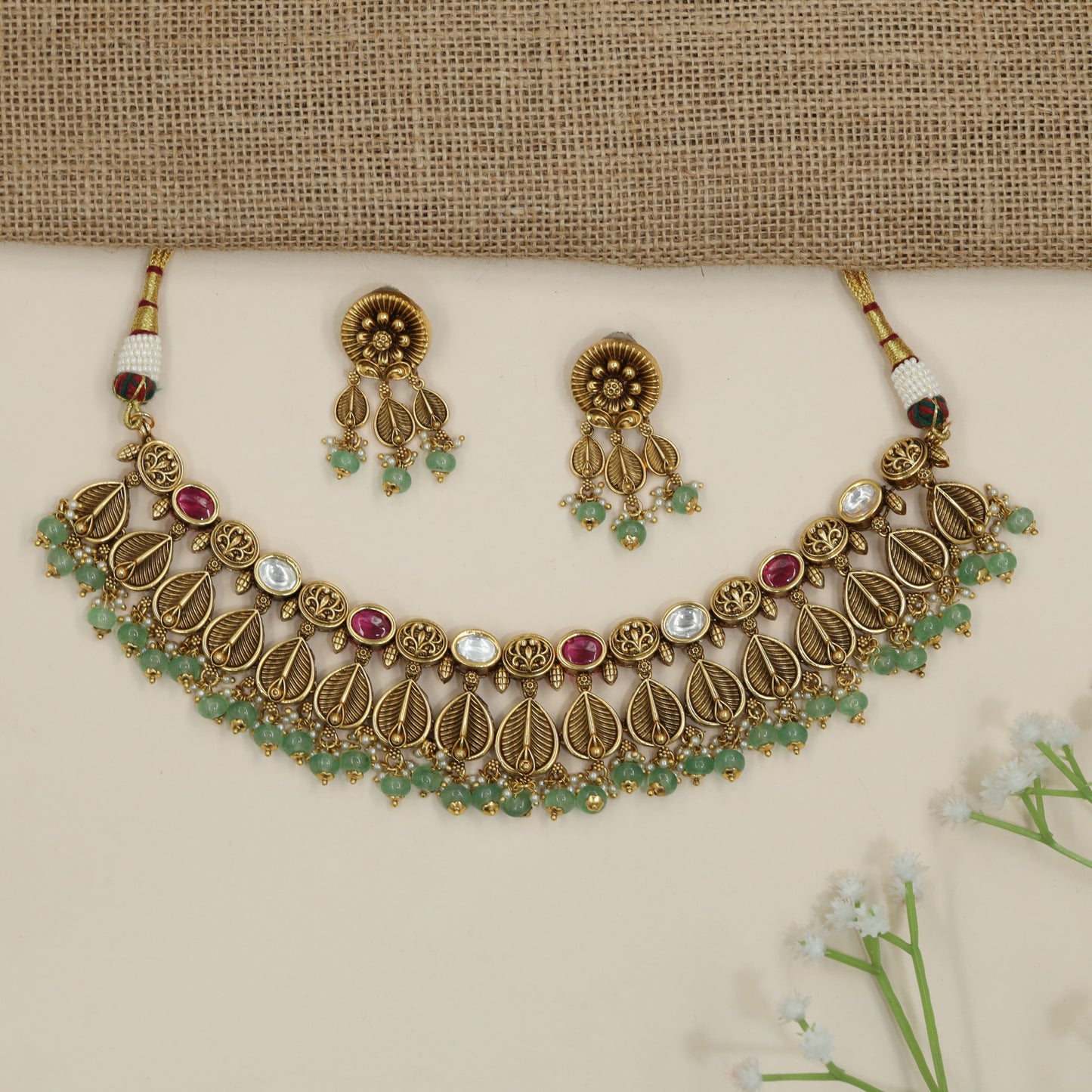 Traditional leaf pattern choker with layered botanical silhouette