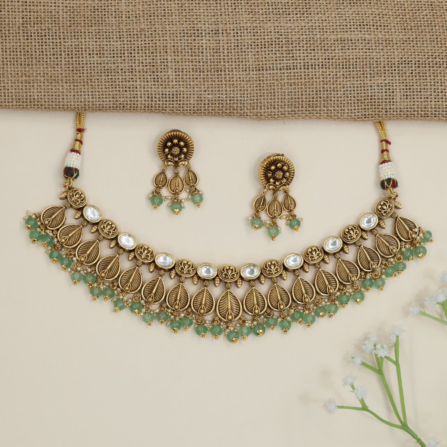 Traditional leaf pattern choker with layered botanical silhouette