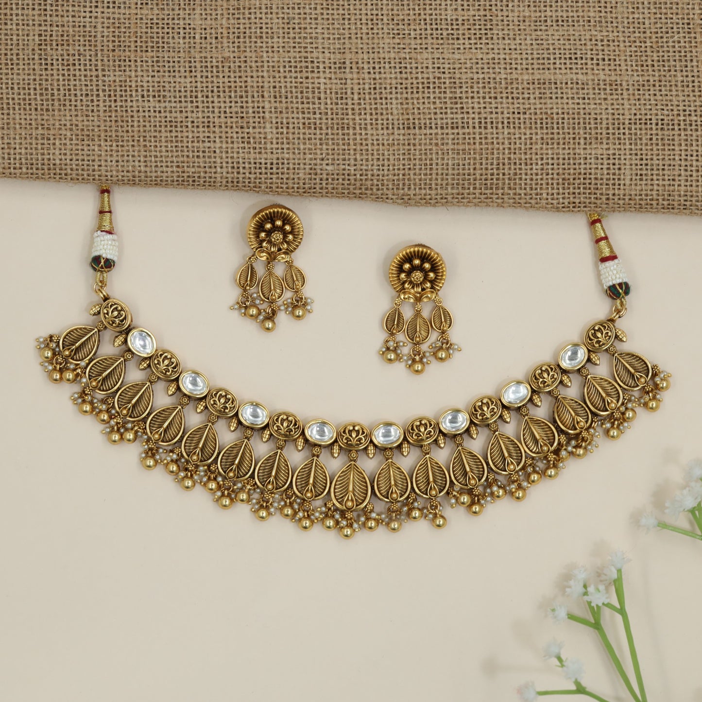 Traditional leaf pattern choker with layered botanical silhouette