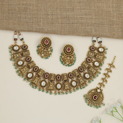 Heritage ornamental choker with engraved motifs and decorative fringe