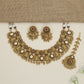 Heritage ornamental choker with engraved motifs and decorative fringe