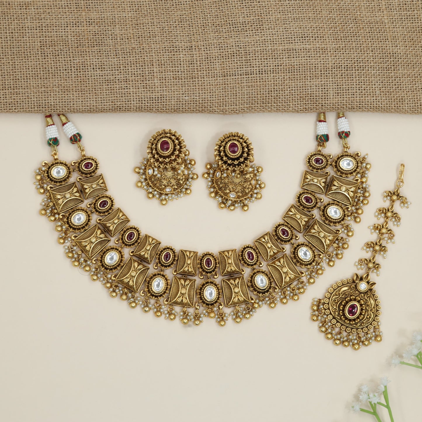 Heritage ornamental choker with engraved motifs and decorative fringe