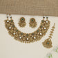 Heritage ornamental choker with engraved motifs and decorative fringe