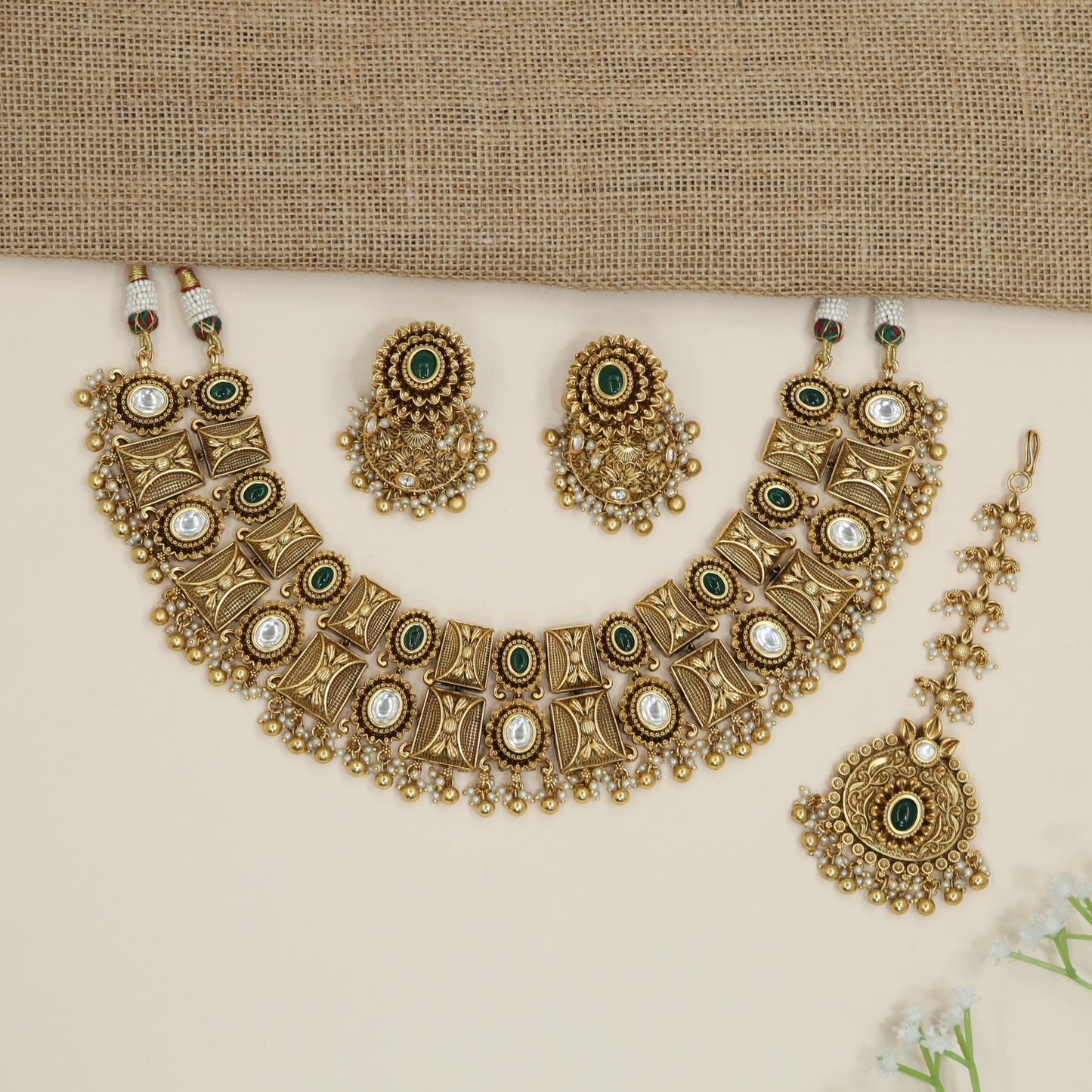 Heritage ornamental choker with engraved motifs and decorative fringe