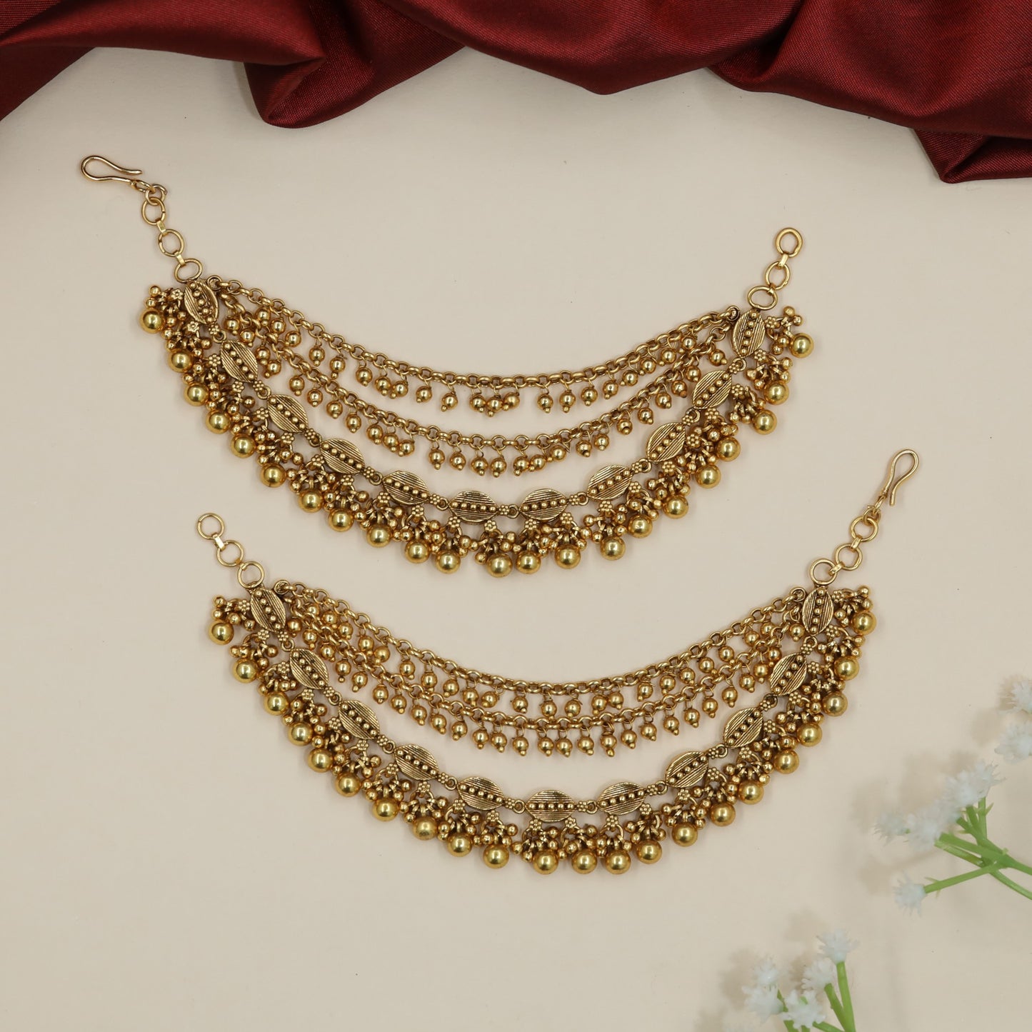 Festive Antique Mati Incorporating Articulated Metal Sections and Delicate Links