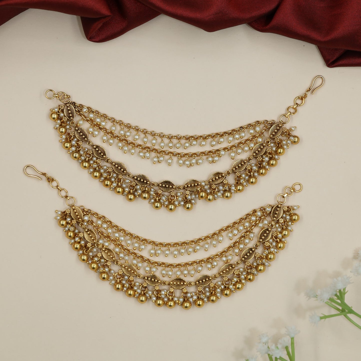 Festive Antique Mati Incorporating Articulated Metal Sections and Delicate Links