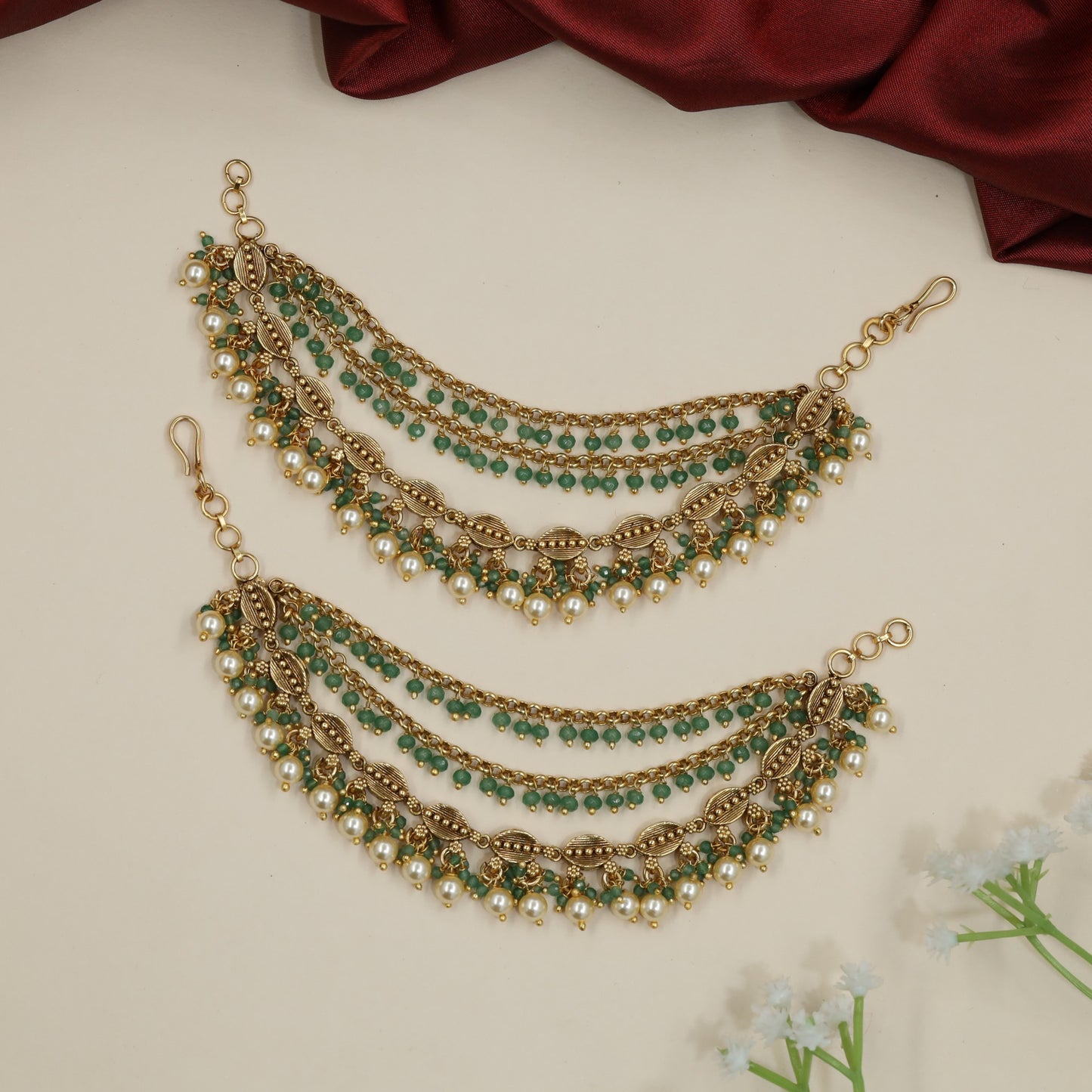 Festive Antique Mati Incorporating Articulated Metal Sections and Delicate Links