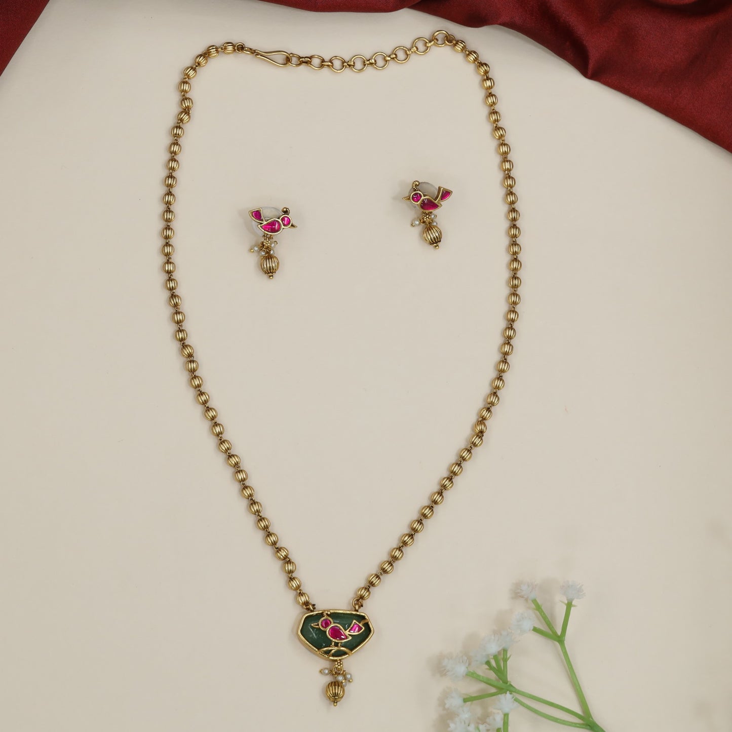Stylized bird Antique Chain With Pendant with textured bead chain detailing