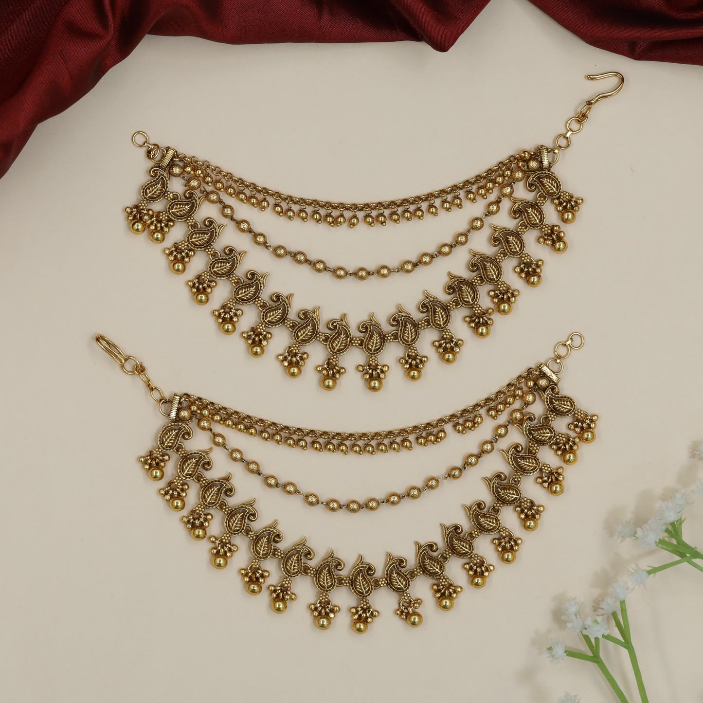 Sculpted peacock Antique Mati with decorative fringe silhouette