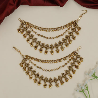 Sculpted peacock Antique Mati with decorative fringe silhouette