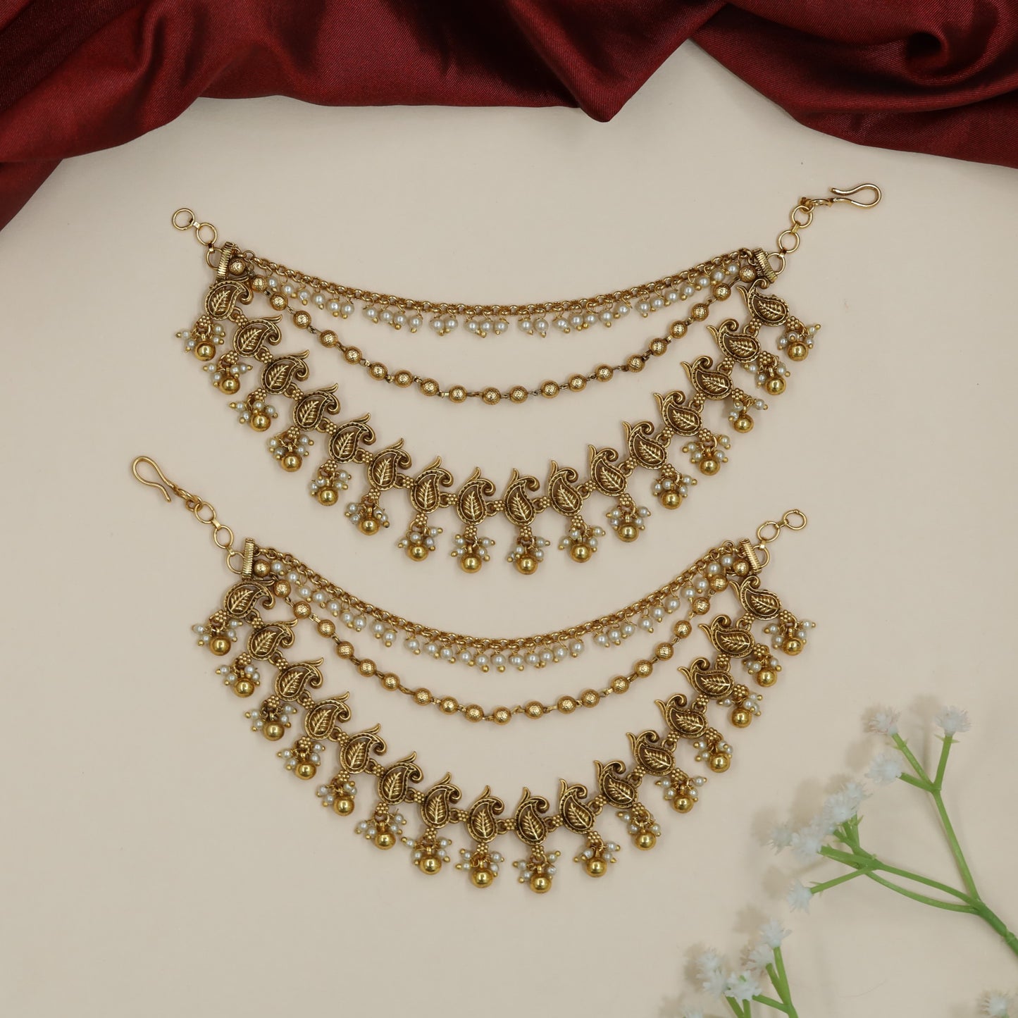 Sculpted peacock Antique Mati with decorative fringe silhouette
