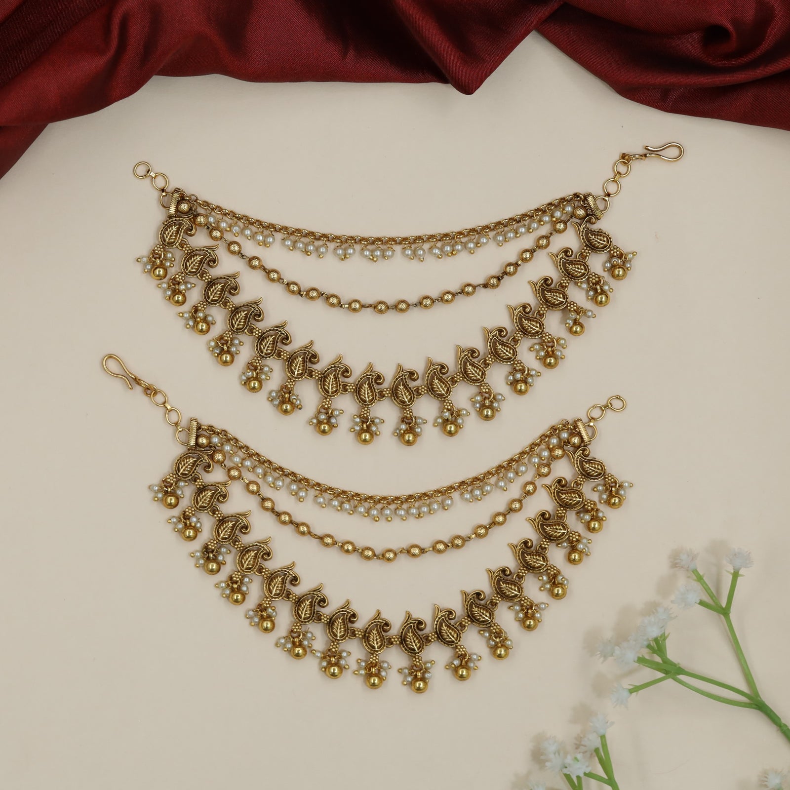 Sculpted peacock Antique Mati with decorative fringe silhouette